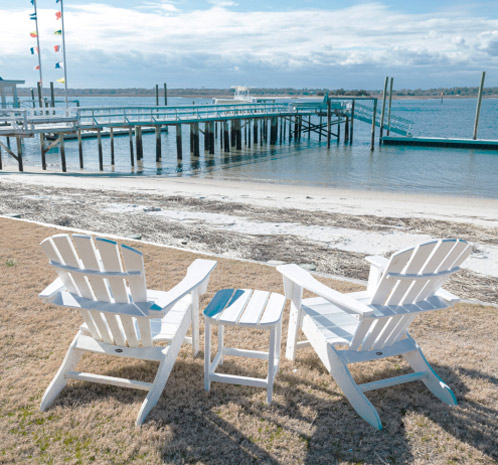 Adirondack chairs on the beach